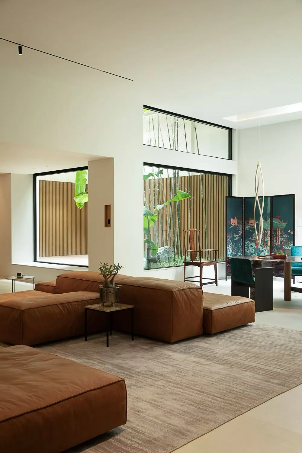 Double-height living room with custom carpentry by a Singapore carpenter