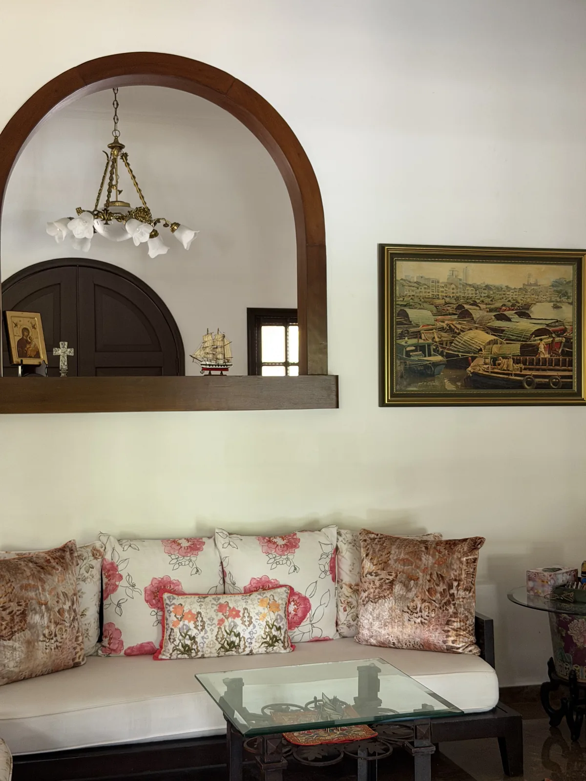Custom timber arched interior window frame in a Singapore home