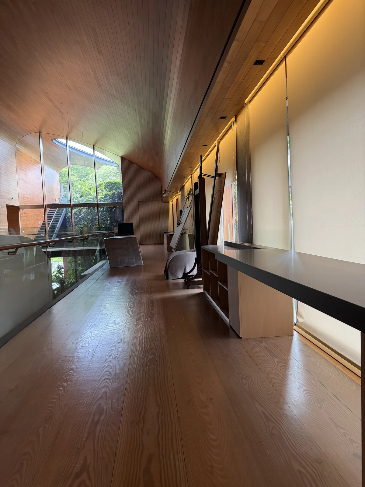 Timber-clad ceiling and flooring on a mezzanine corridor by Takumi Singapore